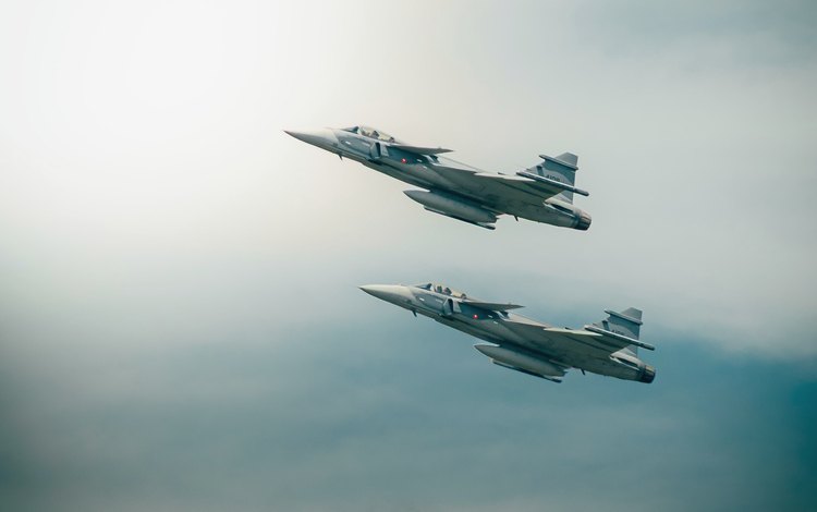 Two aircraft in flight — the aerospace industry