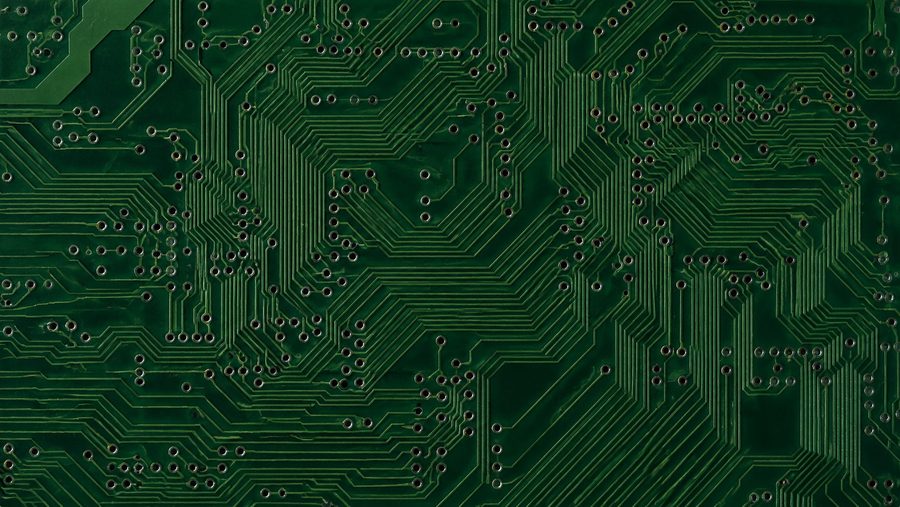 A close-up of copper traces and solder mask on a finished board