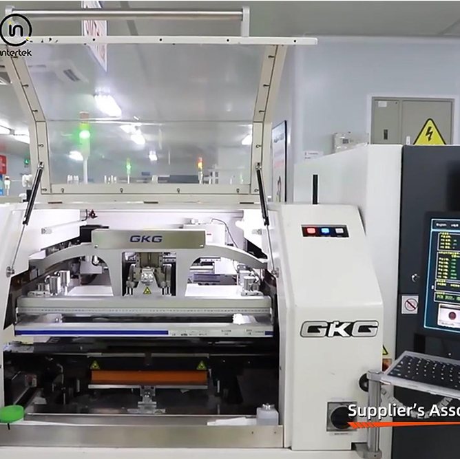 A solder paste printer with a board clamped under the stencil on the SMT line